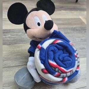 Giants blanket with Disney's Mickey plush hugging it